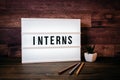 Interns. Text in lightbox