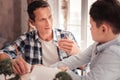 Foster father improving his interpersonal relations with his son