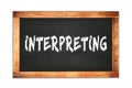 INTERPRETING text written on wooden frame school blackboard