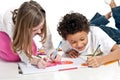 Interracial children drawing together