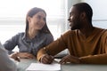 Interracial couple closing deal buy first property signing agreement Royalty Free Stock Photo