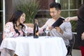 Dating Couple Paying at a Restaurant Royalty Free Stock Photo