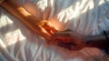 Interracial couple holding hands in bed. Scene of newlyweds on honeymoon. Passionate image