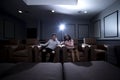 Interracial Couple on a Home Theater Date Royalty Free Stock Photo