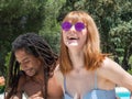 Interracial couple in love, play in the pool. The girl very white and red hair and the boy black Royalty Free Stock Photo