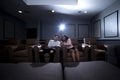 Interracial Couple on a Home Theater Date Royalty Free Stock Photo