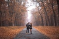 Interracial couple posing in autumn park road Royalty Free Stock Photo