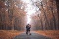 Interracial couple posing in autumn park road Royalty Free Stock Photo