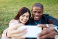 interracial couple taking selfie with smartphone at the Royalty Free Stock Photo