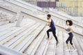 Interracial couple training running up stairs