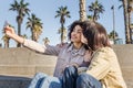Couple of young women doing a selfie with a phone Royalty Free Stock Photo