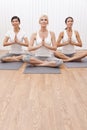 Interracial Group of Three Women In Yoga Position
