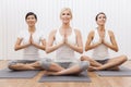 Interracial Group of Women In Yoga Position
