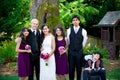 Interracial wedding. Groom standing with his bride's br