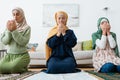 Interracial women and child in hijabs