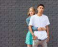 Interracial young couple in love outdoor. Stunning sensual outdoor portrait of young stylish fashion couple posing in summer. Girl Royalty Free Stock Photo