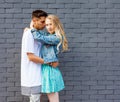 Interracial young couple in love outdoor. Stunning sensual outdoor portrait of young stylish fashion couple posing in summer. Girl Royalty Free Stock Photo