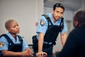 Interrogation, arrest and police team with a suspect for questions as law enforcement officers. Security, crime or Royalty Free Stock Photo