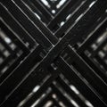 Intersecting black metal bars form a crisscross pattern, creating a geometric design. Royalty Free Stock Photo