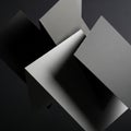 Intersecting dark gray and black geometric shapes in an abstract composition. The forms have a Royalty Free Stock Photo
