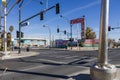 The intersection of Fremont Street and 8th Street downtown with the Downtowner Motel, colorful wall murals, people walking