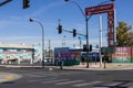 The intersection of Fremont Street and 8th Street downtown with the Downtowner Motel, colorful wall murals, people walking