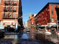 Intersection of Mulberry Street and Grand Street, in New York City during winter daytime against a blue sky