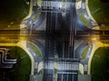 intersection at night from the drone wet road, road lighting wet road, road lighting cars road lanes