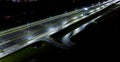 intersection at night from the drone wet road, road lighting