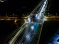 intersection at night from the drone wet road, road lighting wet road, road lighting cars road lanes