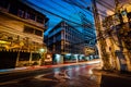 Intersection in Rattanakosin at night, in Bangkok, Thailand.