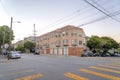 Intersection road in San Francisco, CA with apartment building at the corner with attached garages Royalty Free Stock Photo