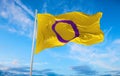 Intersex Pride flag waving in the wind at cloudy sky. Freedom and love concept. Pride month. activism, community and freedom