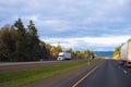 Interstate highway with divided traffic lines and semi trucks dr Royalty Free Stock Photo