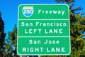 Interstate 280 highway road sign showing drivers the directions to San Francisco and San Jose in sunny Silicon Valley. Green trees Royalty Free Stock Photo