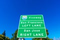 Interstate 280 highway road sign showing drivers the directions to San Francisco and San Jose in sunny Silicon Valley. Green trees Royalty Free Stock Photo