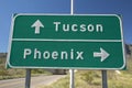 A interstate highway sign in Arizona directing traffic to Tucson and Phoenix, AZ