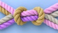 Intertwined colorful ropes create a complex knot, showcasing vibrant textures and a playful design Royalty Free Stock Photo