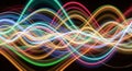 Intertwined luminous neon light waves creating a vibrant, energetic, abstract pattern on a dark background Royalty Free Stock Photo