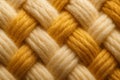 Intertwined yellow and beige wool threads creating a textured pattern Royalty Free Stock Photo