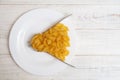 Interval eating, fasting, diet concept. Conditional image of the time of eating pasta and forks on a plate Royalty Free Stock Photo