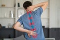 Intervertebral hernia, neck and lumbar pain, man suffering from backache at home, spinal disc disease