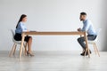 Portrait Of Boss Man And Woman Talking Sitting At Desk Royalty Free Stock Photo