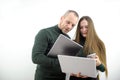 Helpful male boss mentor coach teacher explaining new online project to young female worker student intern, focused Royalty Free Stock Photo