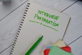 Interview Preparation write on a book isolated on Wooden Table