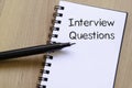 Interview questions write on notebook Royalty Free Stock Photo