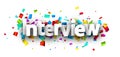 Interview sign over colorful cut out ribbon confetti background