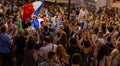 Interview on the street. Football fans of different countries celebrate the victory of the French team