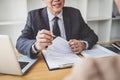 Interviewer or Board reading a resume during a job interview, Employer interviewing a young female job seeker for recruitment