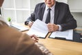 Interviewer or Board reading a resume during a job interview, Employer interviewing a young female job seeker for recruitment Royalty Free Stock Photo